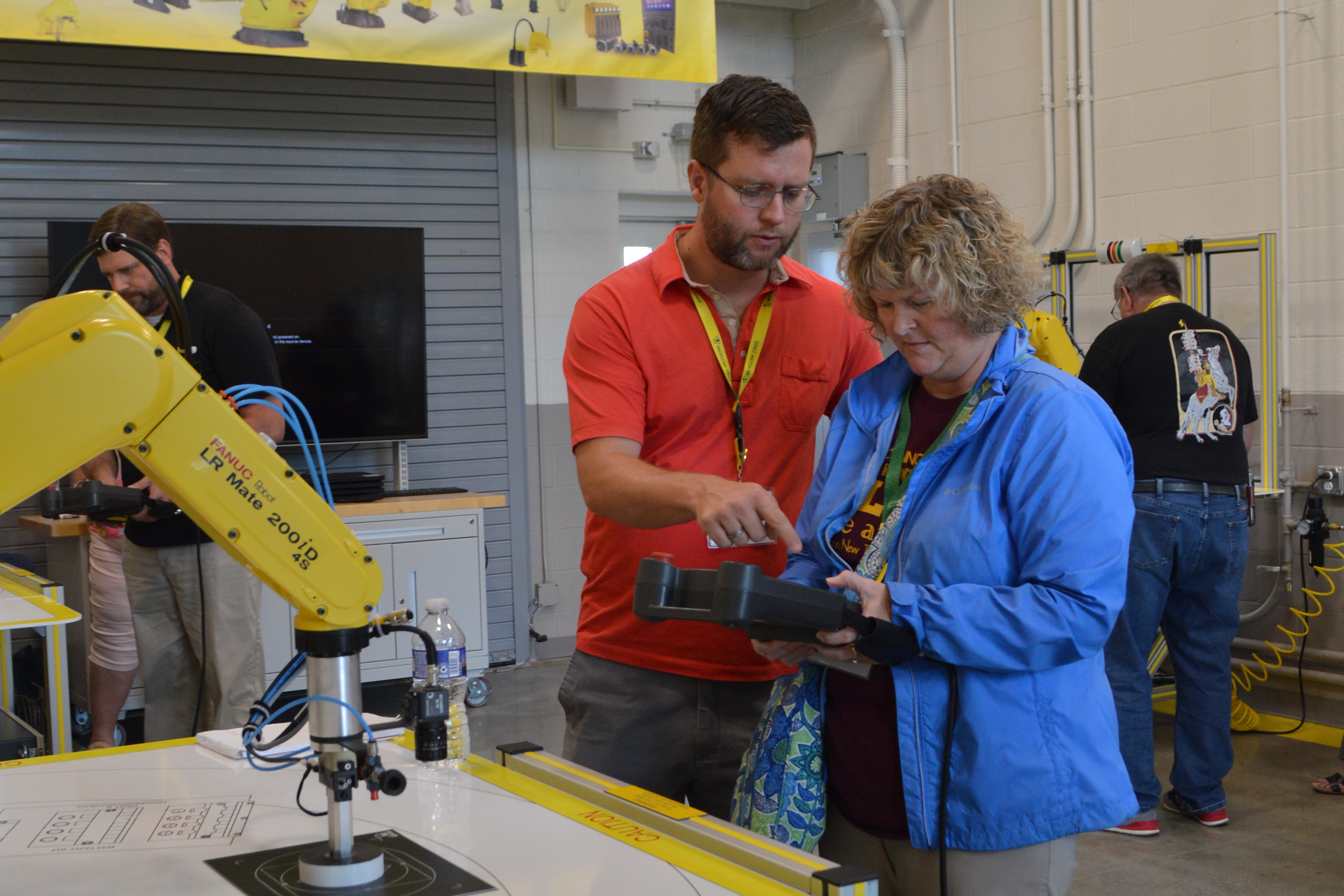 Cannon County School Guidance Counselors Cory Steffes, left, and Chastity Wrisner practice programming a robotic arm at Motlow’s McMinnville campus on July 29 as part of the Motlow/TCAT In-Service Training Day.