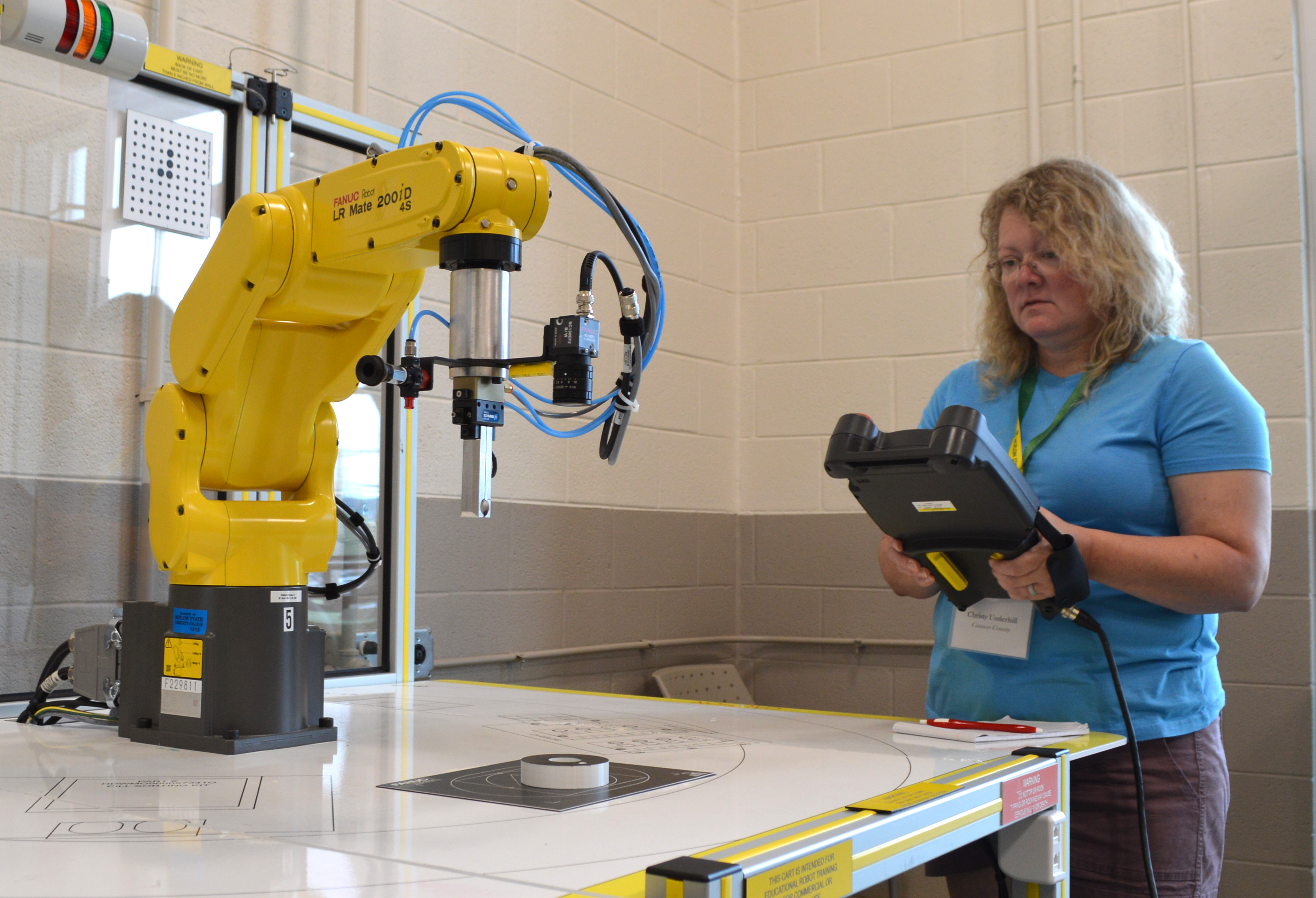 Cannon County Middle School Special Education teacher Christy Underhill practices programming a robotic arm at Motlow’s McMinnville campus on July 29 as part of the Motlow/TCAT In-Service Training Day.