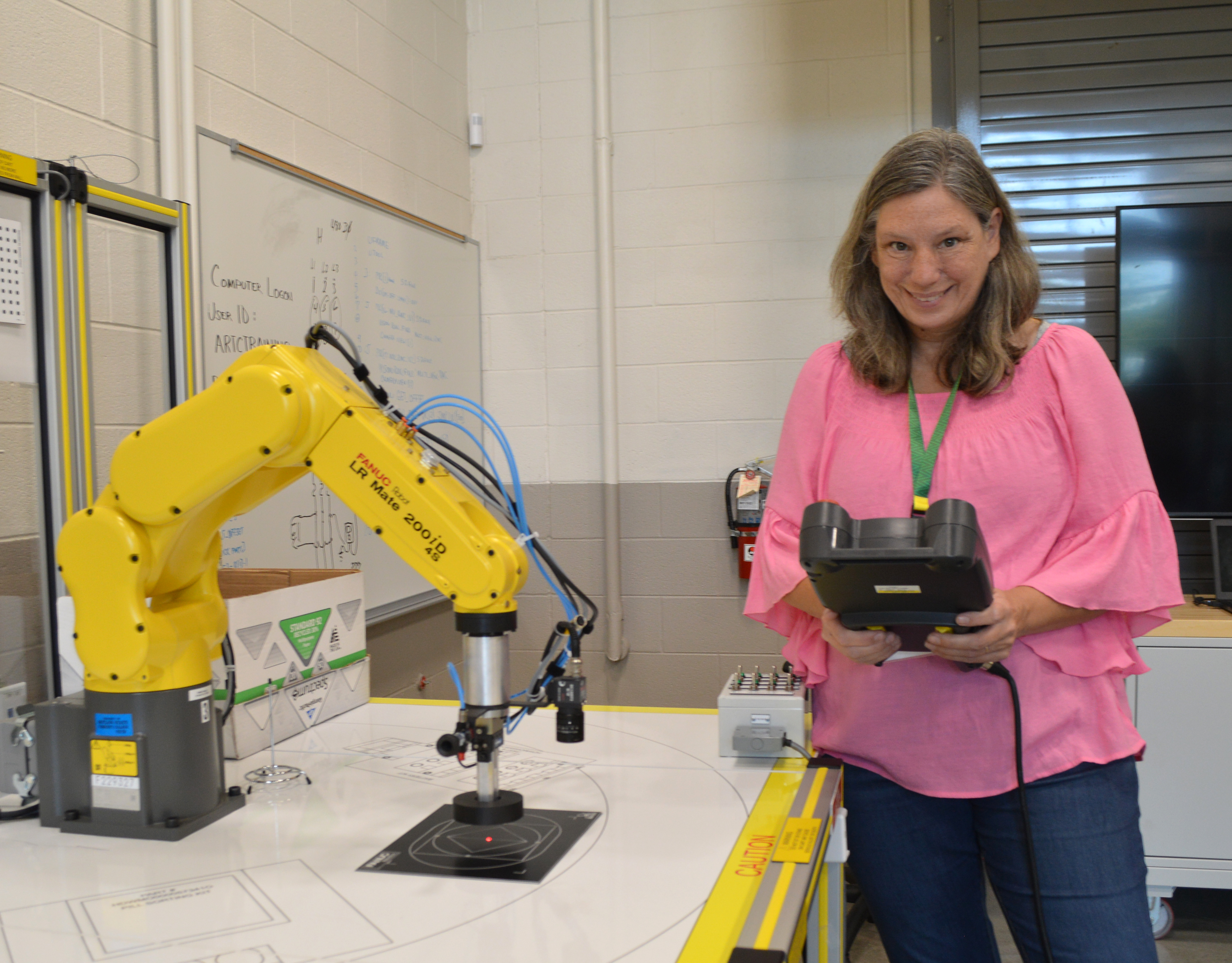 Warren County High School Spanish teacher Linda Taylor practices programming a robotic arm at Motlow’s McMinnville campus on July 29 as part of the Motlow/TCAT In-Service Training Day. Her son graduated from Motlow in 2019 with an Associate of Applied Science in Mechatronics.