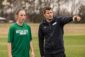 Motlow Women’s Soccer Head Coach, Andy Lyon (right), engages with Motlow Student Abby Tolbert during soccer practice.
