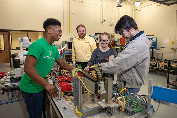Pictured (left to right): Tahjawuan Taylor, Mechatronics Instructor Rick Rogers, Leah Black, and Daylon Timbs. 