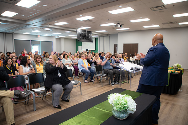 Attendees of Motlow's Academic Honor Awards Ceremony clap for an award recipient
