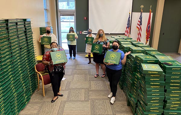 Packing graduation boxes, l-r: Brenda Cannon, co-chair of Commencement Committee and executive director of community relations; Mark Landrum, director of learning space technologies; Tammy Wiseman, internal auditor; Debra Smith, interim dean of students; Emily Seal, associate professor of theatre; and Yer Xiong, secretary III.